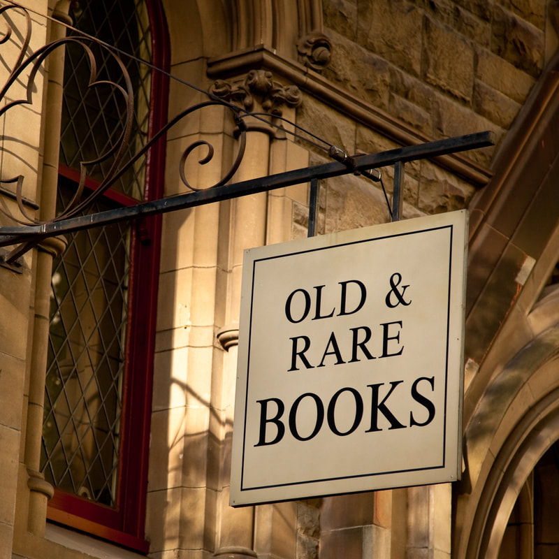 hanging signs for an antique bookstore